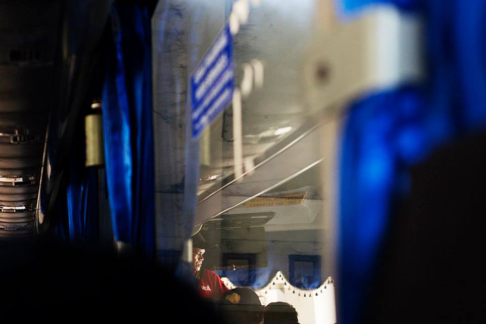 Indonesian busker and blue bus